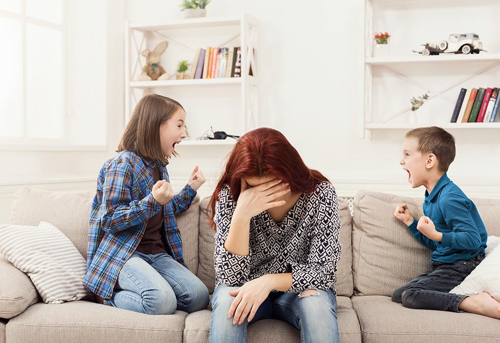 stressed parent struggling to cope when siblings are fighting